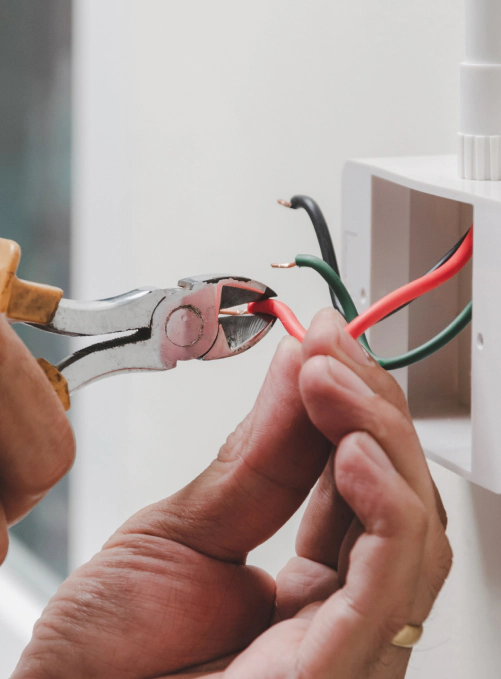 man fixing electrical wiring